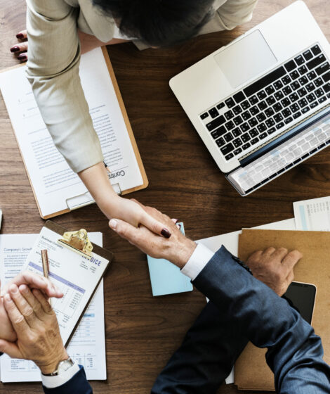 Business people shaking hands together